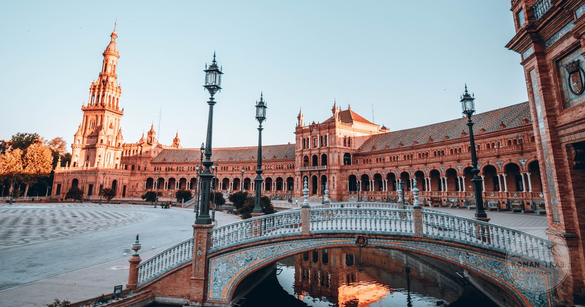 Plaza de Espana canal and tiled bridge at golden hour, Seville travel guide for women by Roman Trail Outfitters