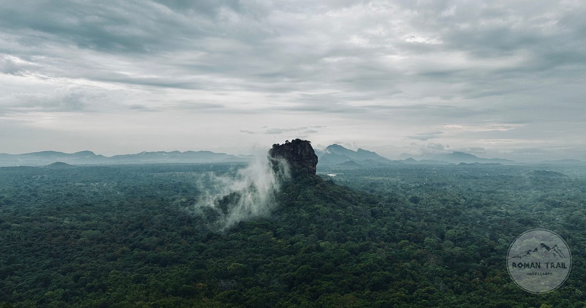 Aerial view of Sigiriya rock among forest and misty cloud, Sri Lanka