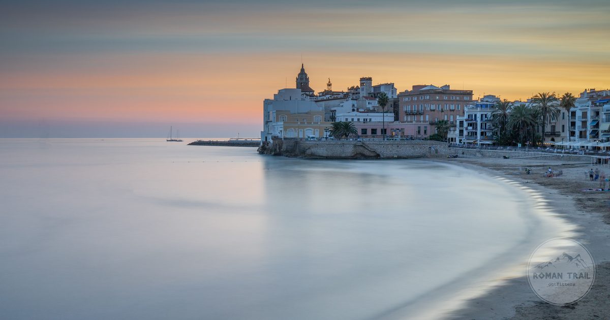 Twilight over the beach and old town at Sitges, Catalonia, Spain
