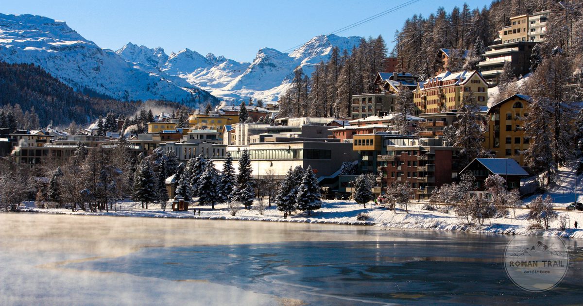 St Moritz with snowy mountains and the frozen lake in winter, Switzerland