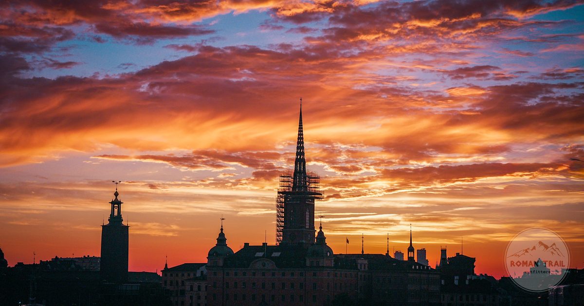 Stockholm skyline silhouetted against a dramatic sunset sky, Stockholm travel guide for women by Roman Trail Outfitters