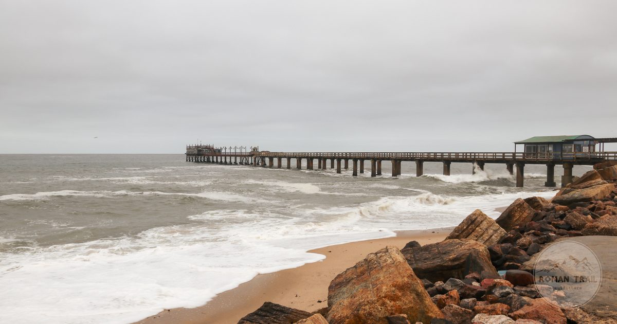 Waves against the shore beside the pier at Swakopmund, Namibia