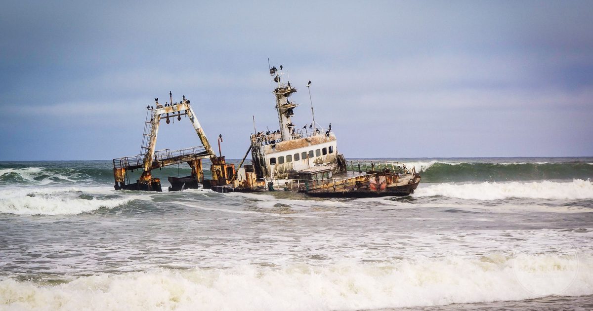 A rusting shipwreck on the rugged coast near Swakopmund, Namibia