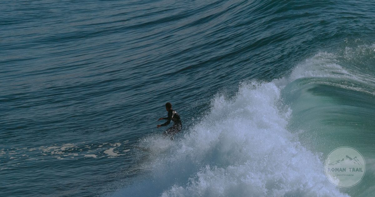 A surfer riding a wave at Taghazout, Morocco