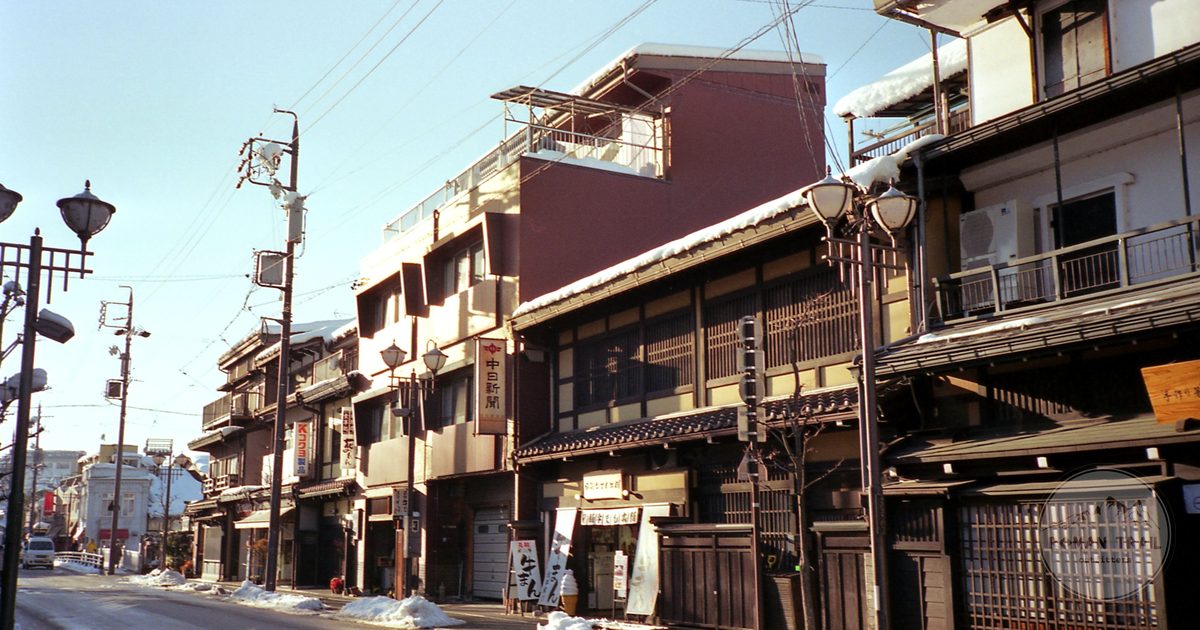 A historic merchant street of dark timber houses in Takayama, Takayama packing list for women by Roman Trail Outfitters