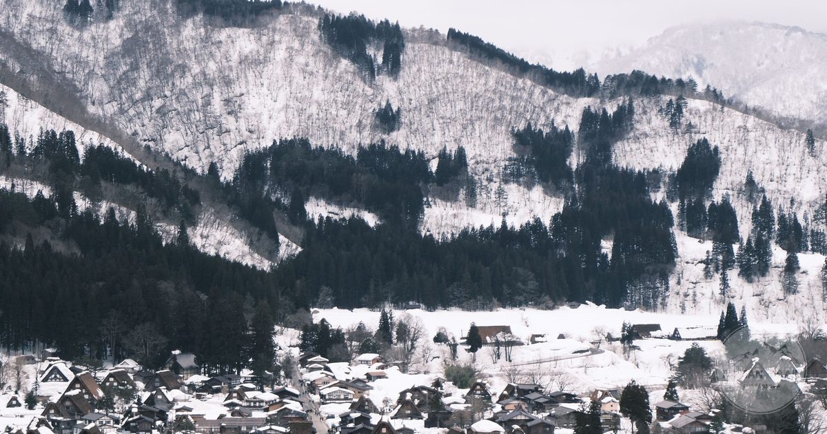 Snow covered thatched farmhouses at Shirakawa-go in Gifu, Takayama packing list for women by Roman Trail Outfitters