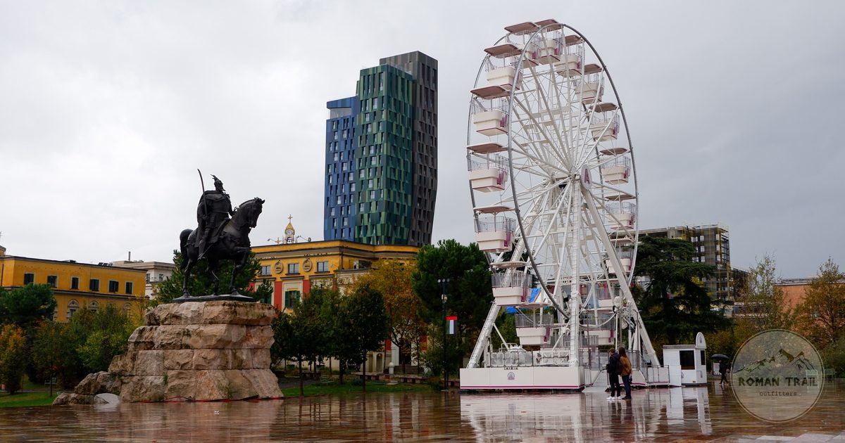 Skanderbeg Square in Tirana, Albania, with a ferris wheel behind it