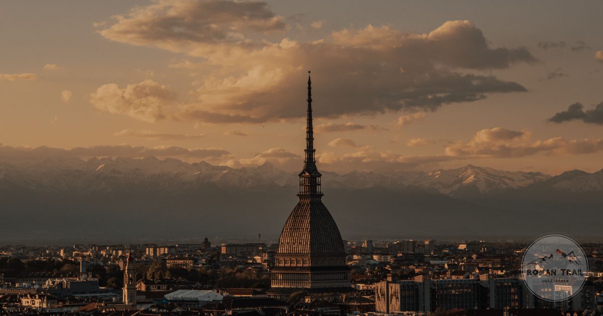 Sunset over the Mole Antonelliana with mountains behind, Turin, Italy