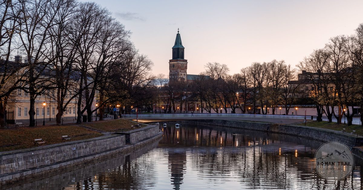 Turku Cathedral reflected in the Aura river at dusk, Finland