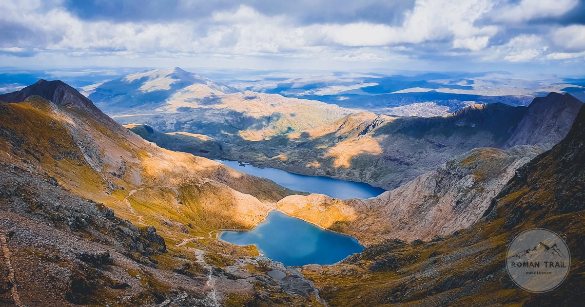 The Snowdonia mountain range above a lake in Wales