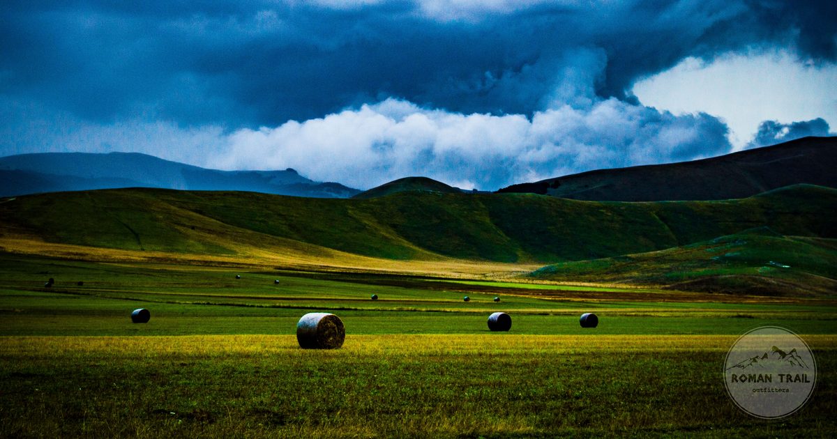 Rolling hills and hay bales at Castelluccio, Umbria, Italy