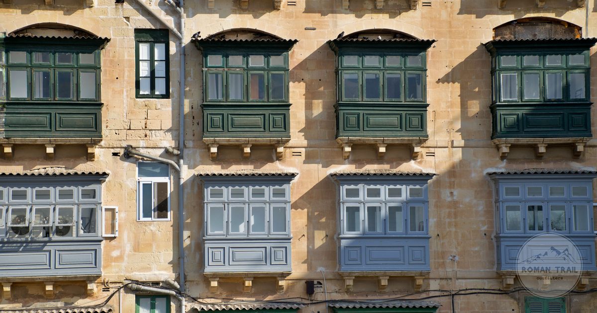 Traditional enclosed balconies on a facade in Valletta, Malta