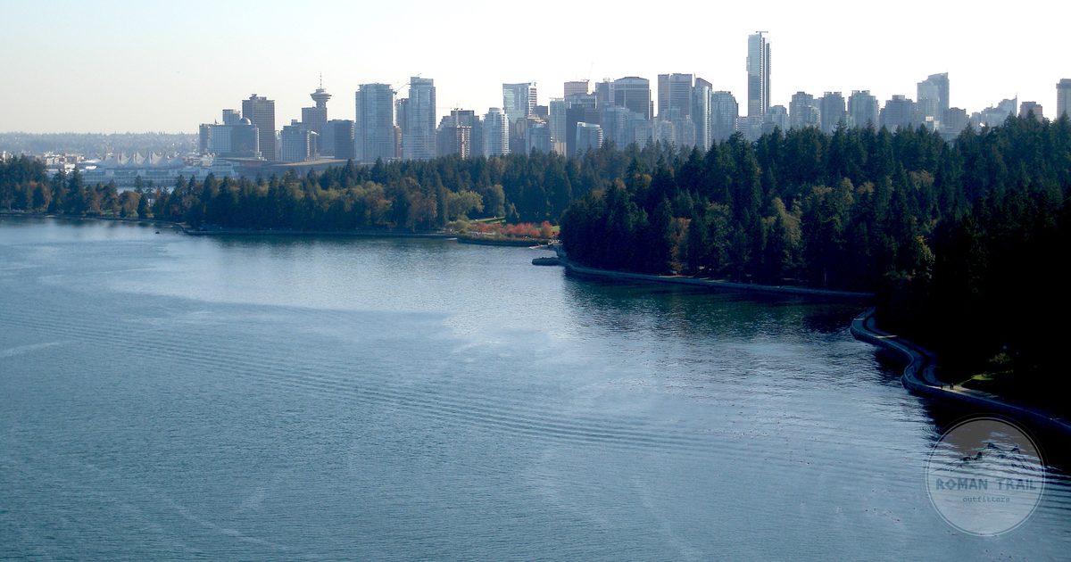 Vancouver skyline seen across the water from Stanley Park, Vancouver travel guide for women by Roman Trail Outfitters