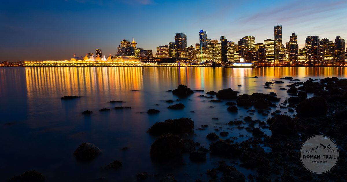 Vancouver waterfront skyline reflected in the water at night, Vancouver for women travelers