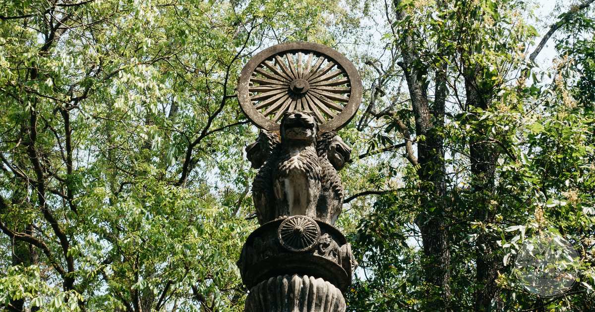 The Ashoka Pillar among trees at Sarnath, India