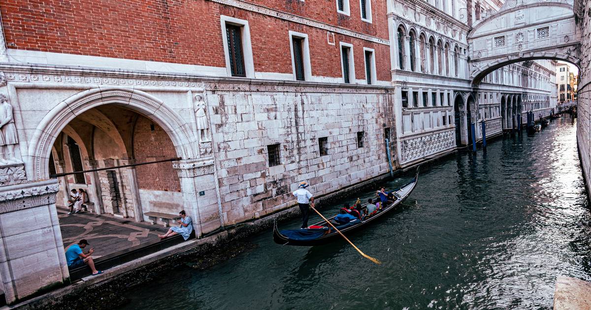 A gondola gliding under the Bridge of Sighs in Venice, Italy