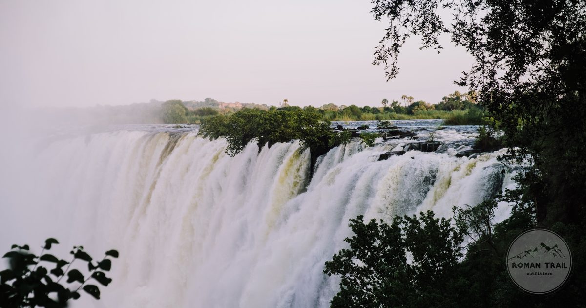 Victoria Falls surrounded by rainforest greenery, Zambezi river