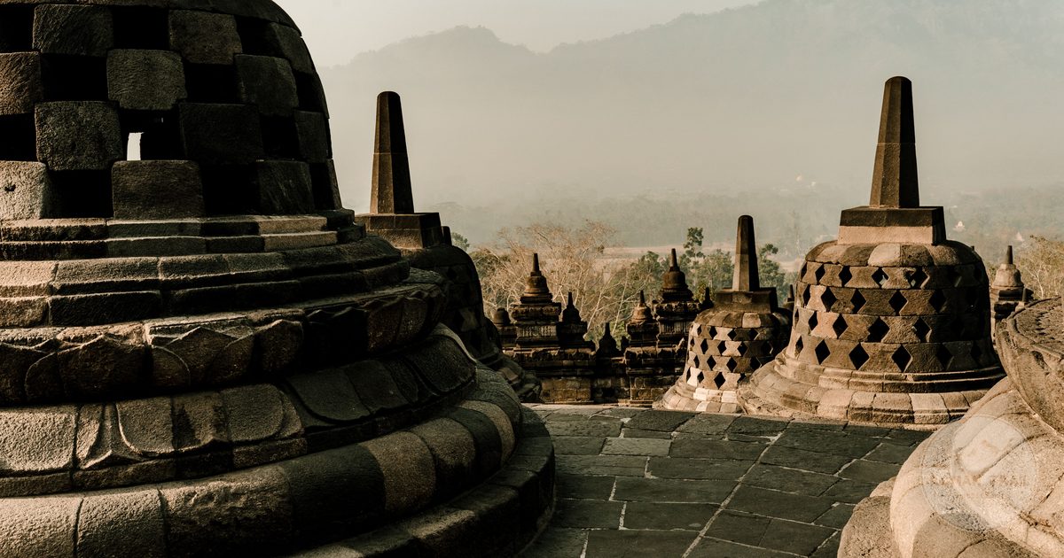 The stupas of Borobudur temple at sunrise in Central Java, Yogyakarta packing list for women by Roman Trail Outfitters