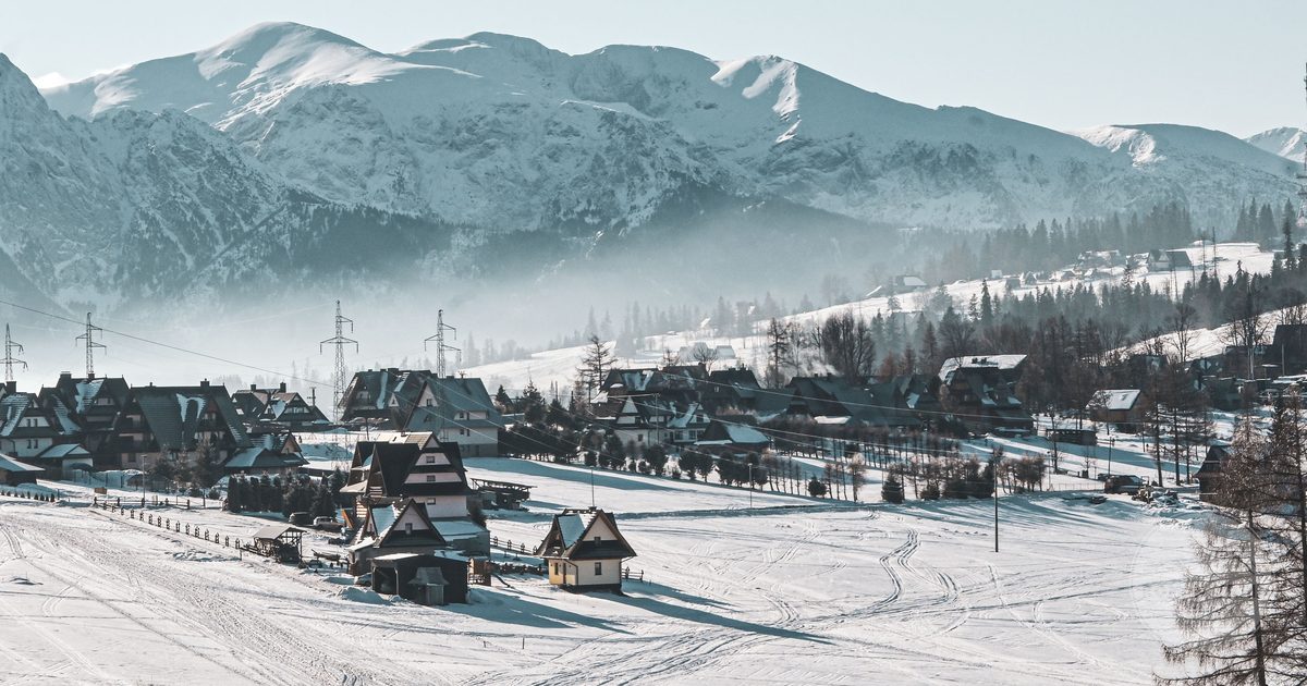 A snow-covered village below the mountains at Zakopane, Poland
